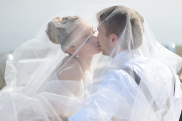 Happy bride and groom on a yacht