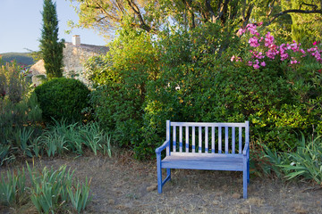 Blue painted wooden garden bench, Provence, France.