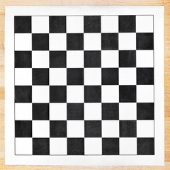 black and white vinyl checkerboard on wooden table