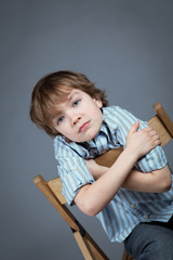 Portrait of boy on a gray background