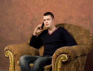 Concerned young man talking on his mobile