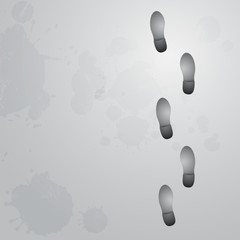 Conceptual step by step footprint on gray background with ink sp