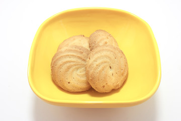 homemade pastry cookies in Melamine bowl on white back