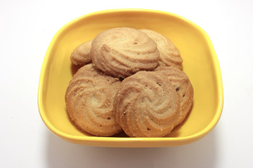 homemade pastry cookies in Melamine bowl on white back