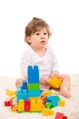 Baby boy playing with building blocks