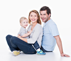 Happy young family with little child.