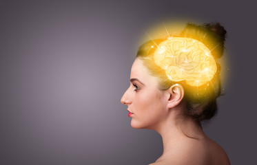 Young girl thinking with glowing brain illustration