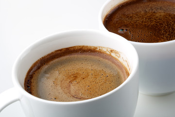 cups of coffee on white background