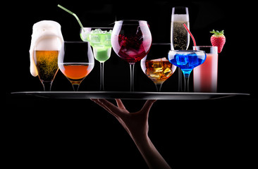 different alcohol drinks set on a tray