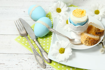 Easter table setting with flowers and eggs