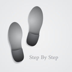 Conceptual step by step footprint on gray background