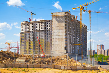 Construction site. Yellow construction crane.