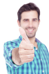 Handsome latin man thumbs up over a white background
