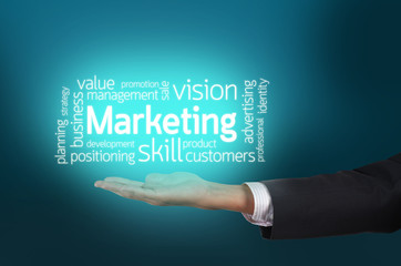 Businessman hand holding marketing text