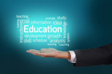 Businessman hand holding Education text wording