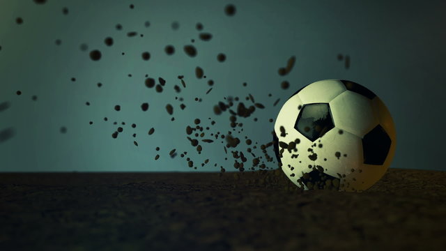 slow motion soccer ball with peaces of dirt