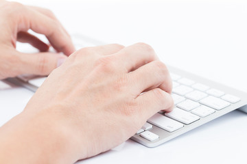 Man hand typing on keyboard