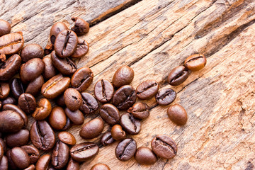 Coffee on grunge wooden background Fresh coffee beans on wood