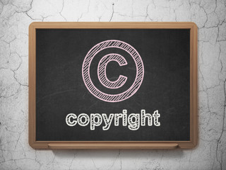 Law concept: Copyright and Copyright on chalkboard background