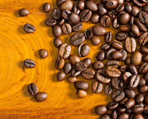 Coffee beans on wood background