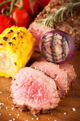 Roast beef with cherry tomatoes, corn and spices
