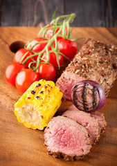 Roast beef with cherry tomatoes, corn and spices