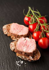 Roast beef sandwich. Background chalk board