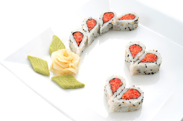 Sushi nicely decorated forming hearts  shapes on white square di