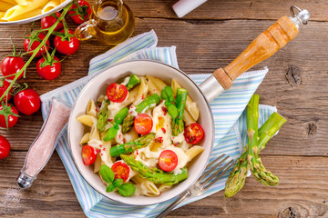 Noodles with asparagus in cream-cheese sauce