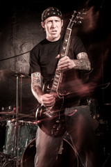 Obraz na płótnie Canvas Heavy metal guitar player