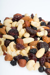 mixed nuts and dried fruits isolated on white background