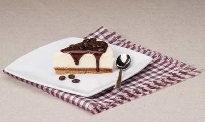 Cheese Cake With Chocolate Sauce On White Plate