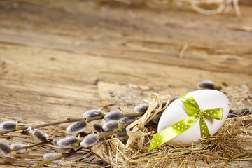 Easter egg nest on rustic wooden background