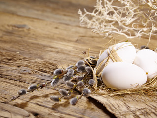 Fototapeta na wymiar Easter egg nest on rustic wooden background