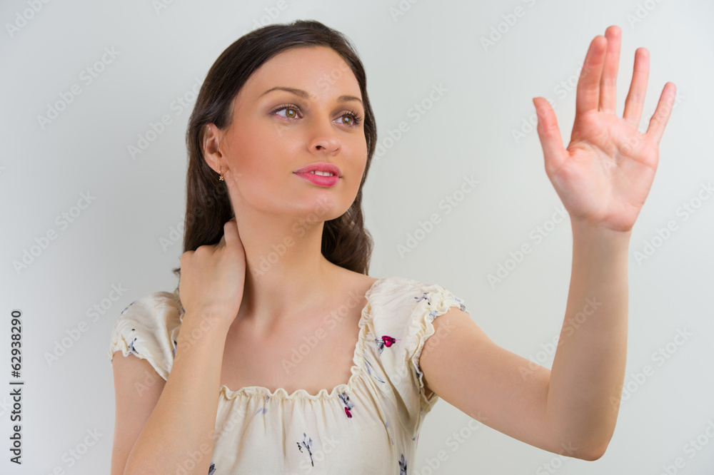 Wall mural woman touching virtual button