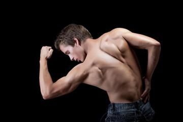 Fototapeta na wymiar Image of handsome muscular man showing his biceps