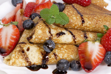Pancakes with strawberries and blueberries