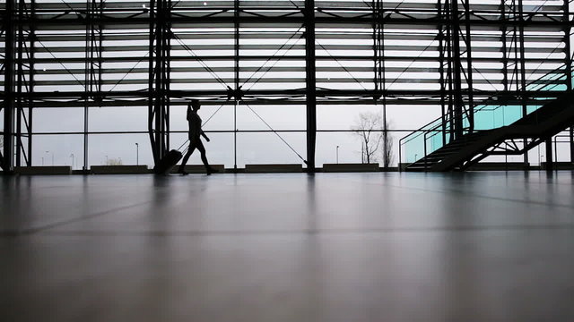 Woman walking in airport terminal