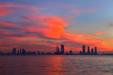Fototapeta na wymiar orange red sky during sunset and Bahrain skyline, HDR photograph