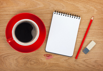 Blank notepad with office supplies and red coffee cup
