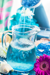 Preparing relaxing spa bath aromatic pouring salt