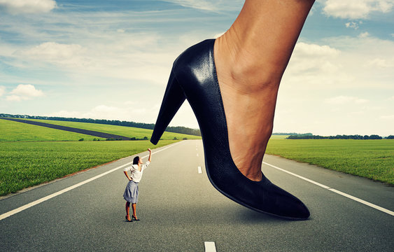 woman showing fist and screaming at big lady boss on the road