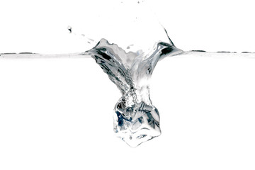 Ice cube splashing into water isolated on white
