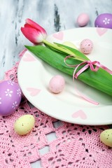 Easter table setting with tulips and eggs