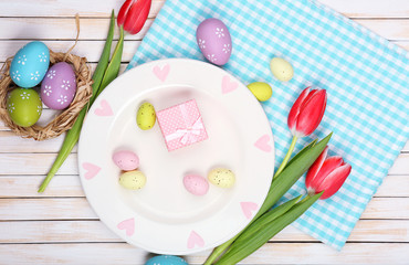 Easter table setting with tulips and eggs