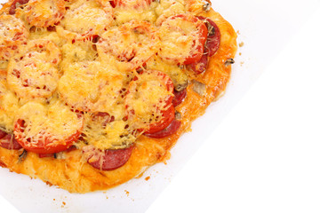 Homemade pizza on baking paper isolated on white