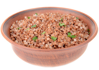 Boiled buckwheat in bowl isolated on white