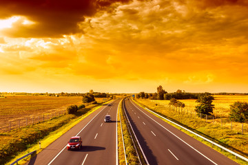 Cars speeding on a highway