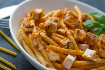 pasta with tomato sauce and chicken breast