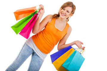 attractive young woman with colorful shopping bags